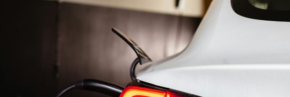 the tail light of a white car in a garage